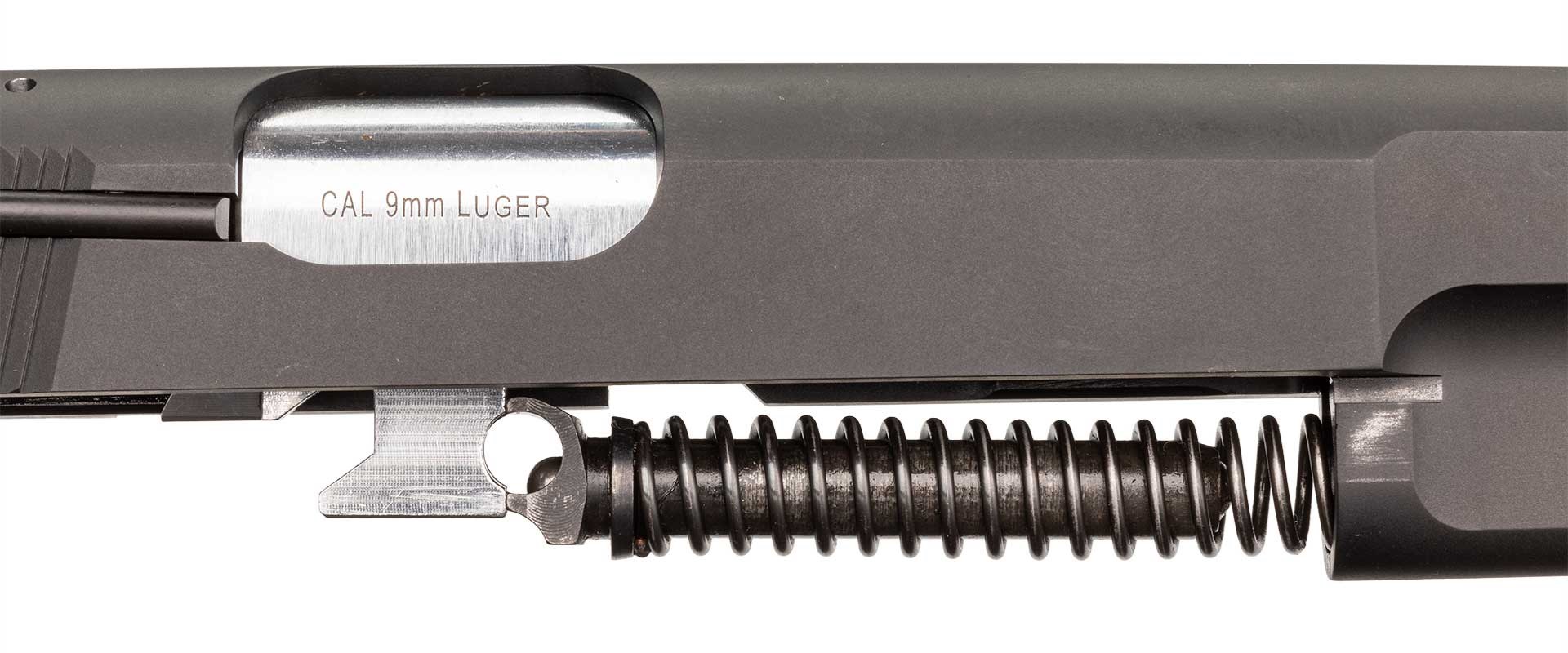 Stripped Springfield SA-35 slide showing the barrel linkage and recoil spring.