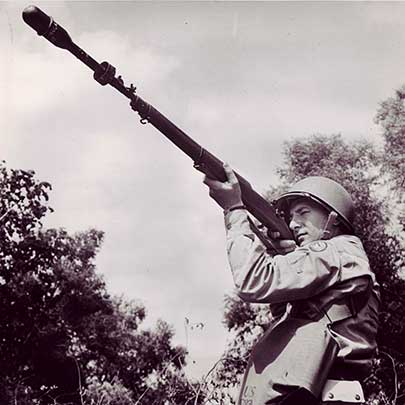 A U.S. Army soldier about to fire a M9 rifle grenade from his M1903A3 rifle.