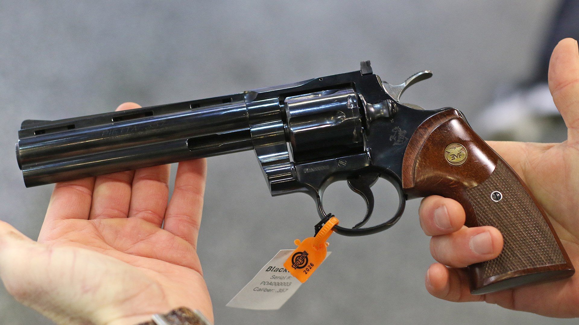 Man displaying the Pietta Blacktooth revolver at SHOT Show.