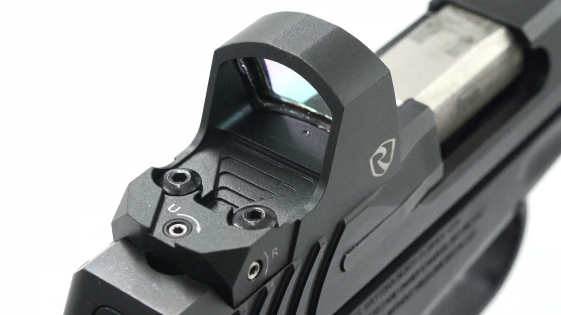 black metal plastic gun handgun pistol parts closeup optics sights barrel slide