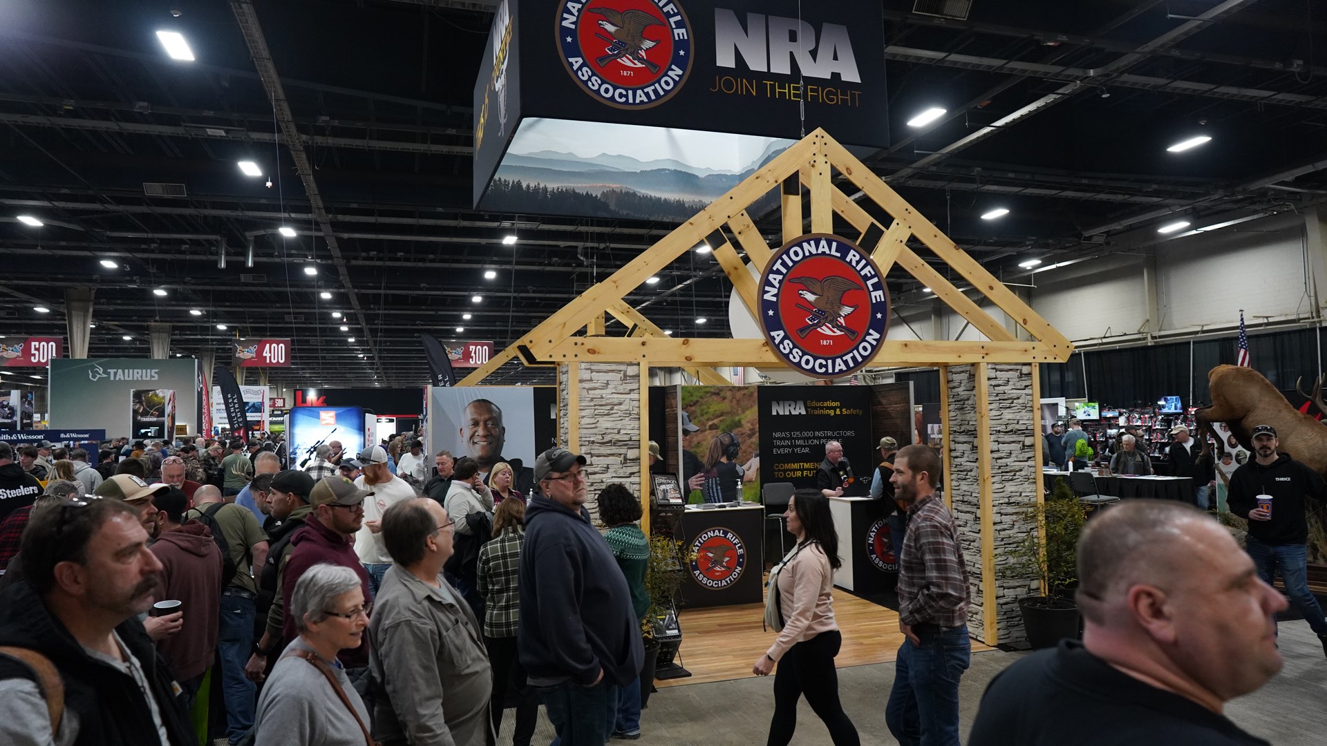 NRA booth at Great American Outdoor Show, Harrisburg, PA 2024 people indoors expo