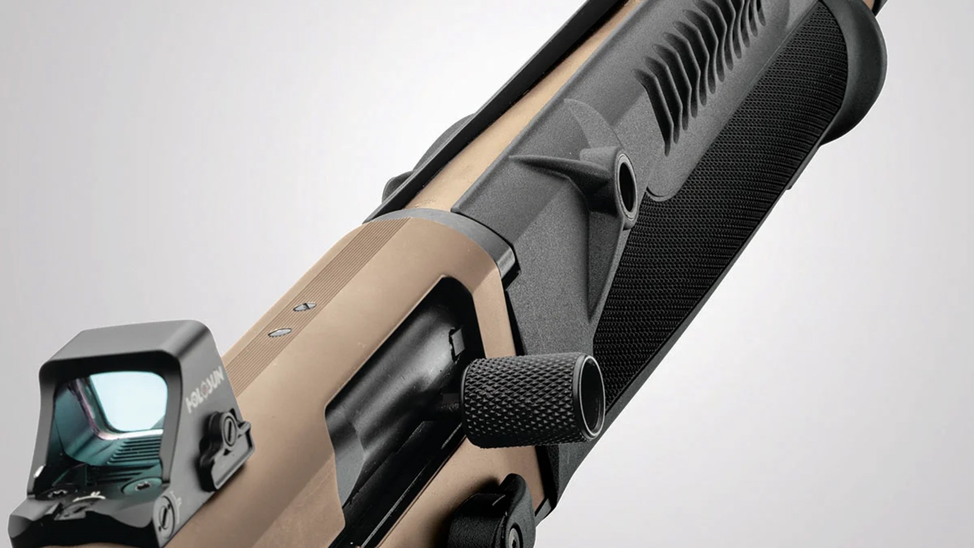 Details on the right side of the Mossberg 940 Pro Tactical shotgun, including red-dot optic mount, bolt handle and redesigned forend.