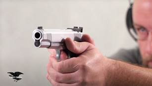 Man shooting gun target stainless steel M1911 range indoors remote camera 