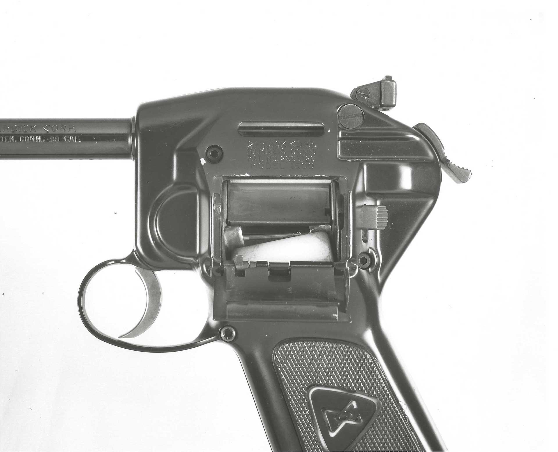 The left side of the Dardick pistol, showing the open-chamber on the side of the handgun.