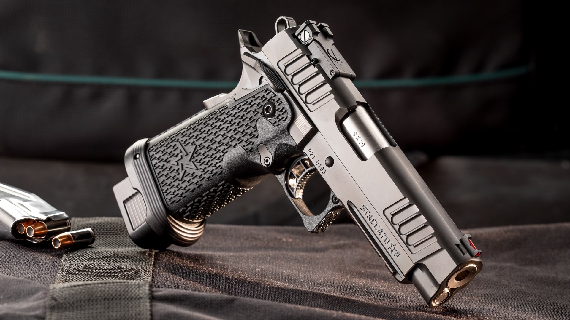 Right-side view of Staccato-P pistol black gun modern 1911 with target sights and double-stack magazine