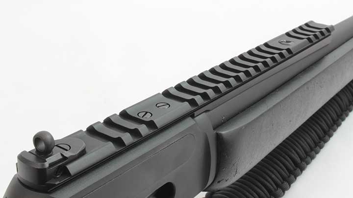 The flat-top receiver with Picatinny rail segment for mounting optics.