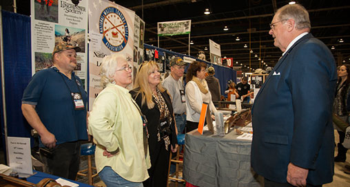 NRA President Jim Porter greets exhibitors