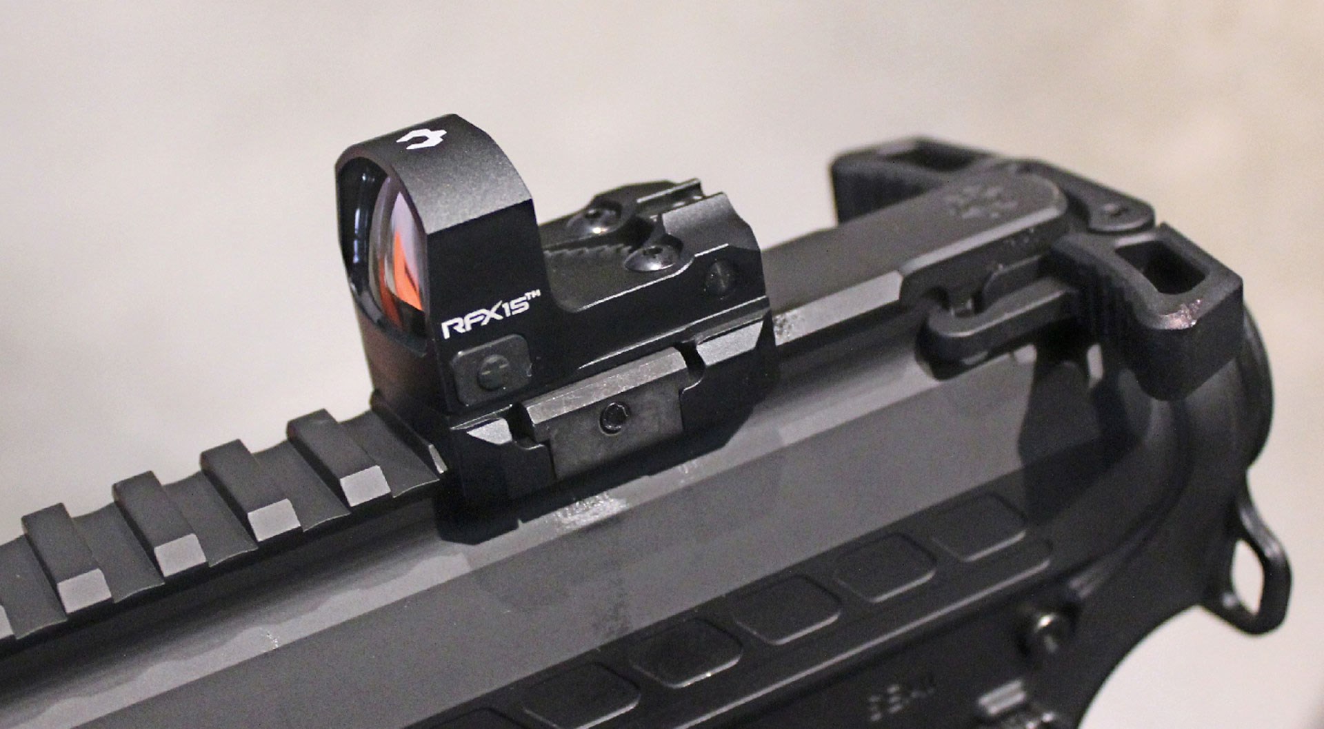 cmmg banshee with optic attached top rain gun handgun pistol parts closeup