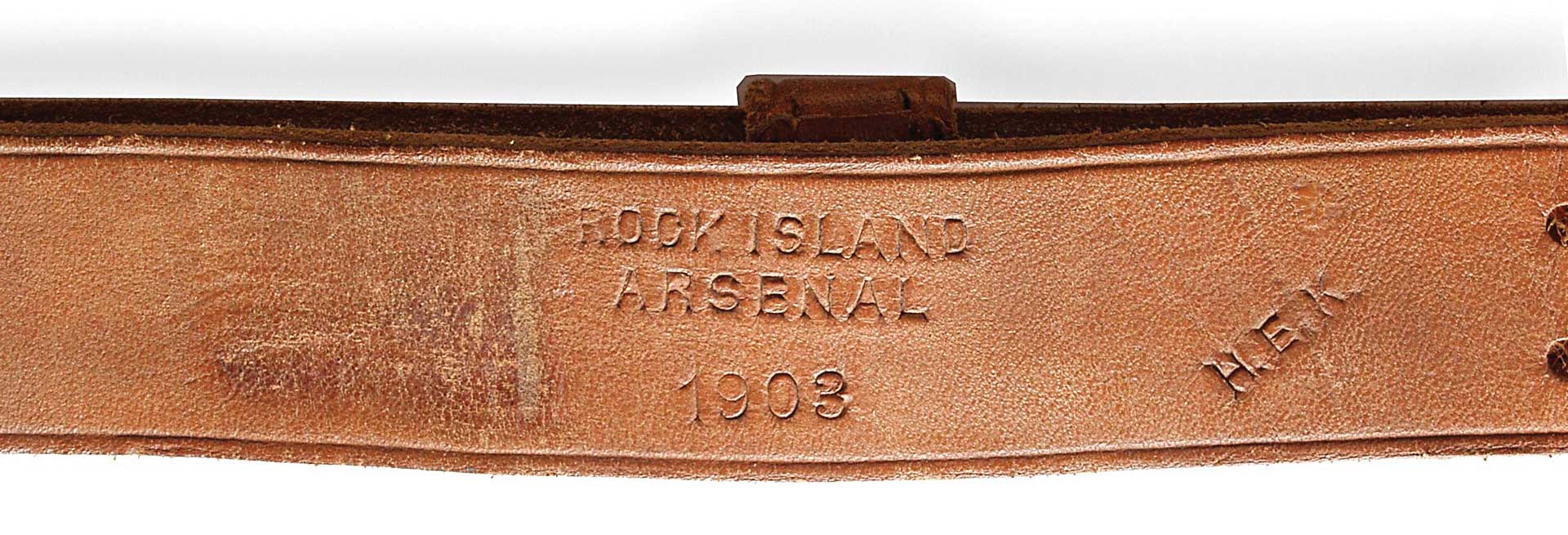 brown leather sling stamped with Rock Island Arsenal