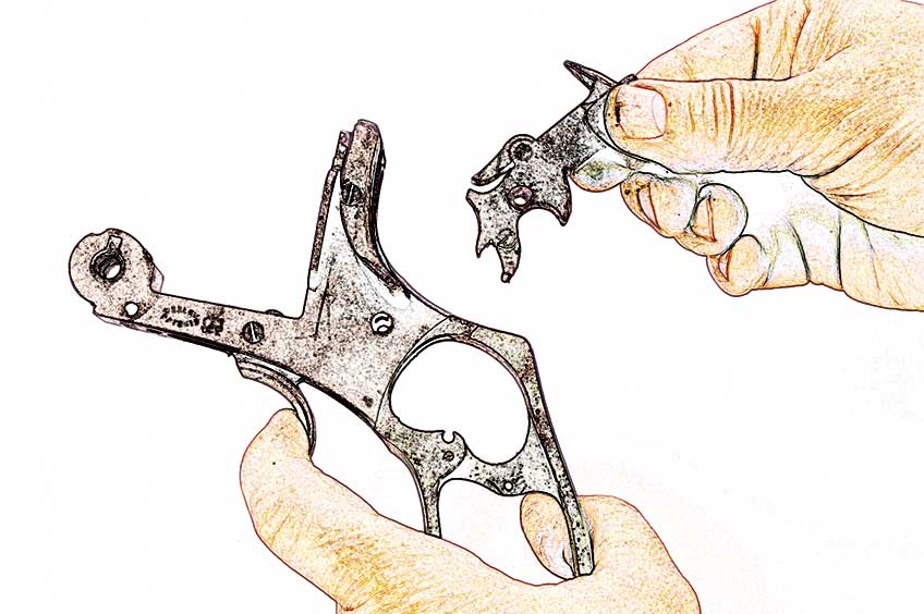 revolver parts cartoonized in hands