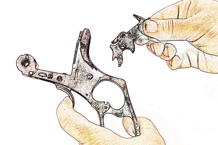 revolver parts cartoonized in hands