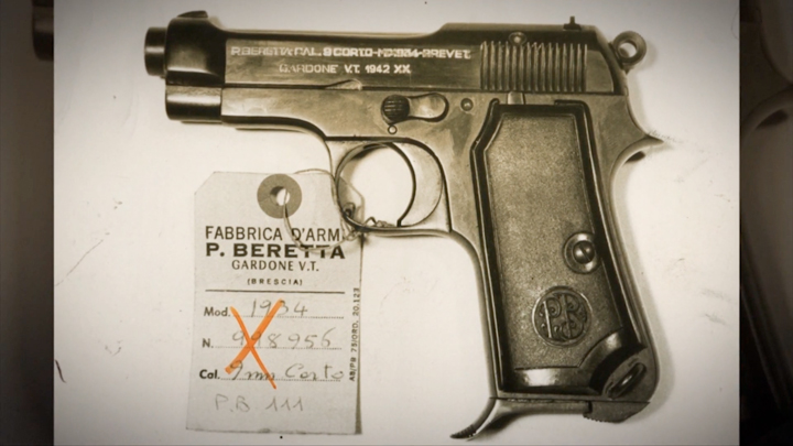 Left-side view of Beretta 1934 pistol with inventory tag.
