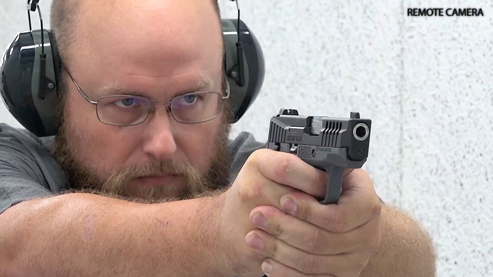 Man on shooting range with Savage Stance pistol 9 mm