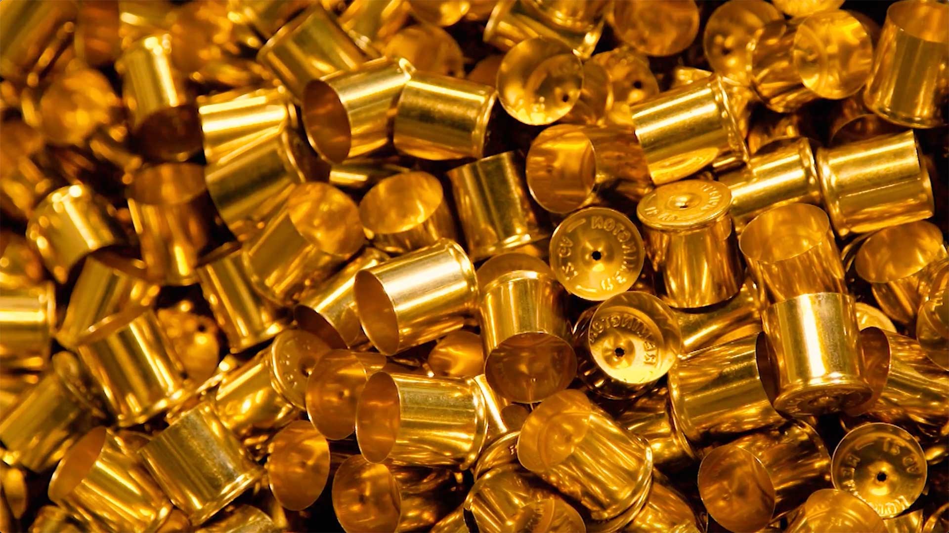 Freshly produced brass shotshell caps waiting to be assembled.