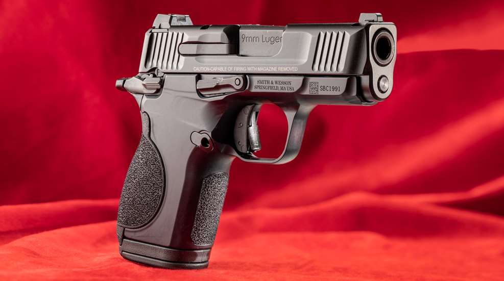 Smith & Wesson CSX handgun pistol semi-automatic red background black gun