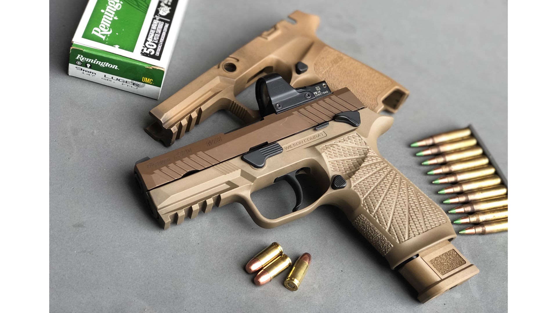SIG Sauer M18 pistol 9 mm ammunition with wilson combat grip frame conversion attached