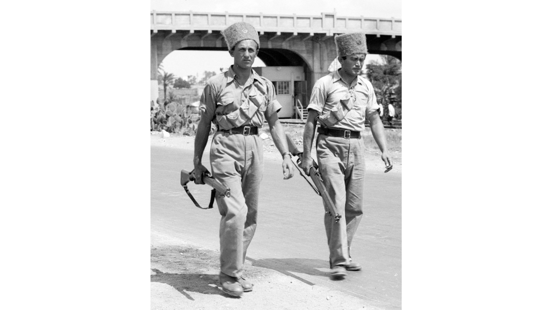 Equipped with Rifle No. 1 Mk III by the British, Jewish Supernumerary policemen patrol the streets of Haifa.  Library of Congress