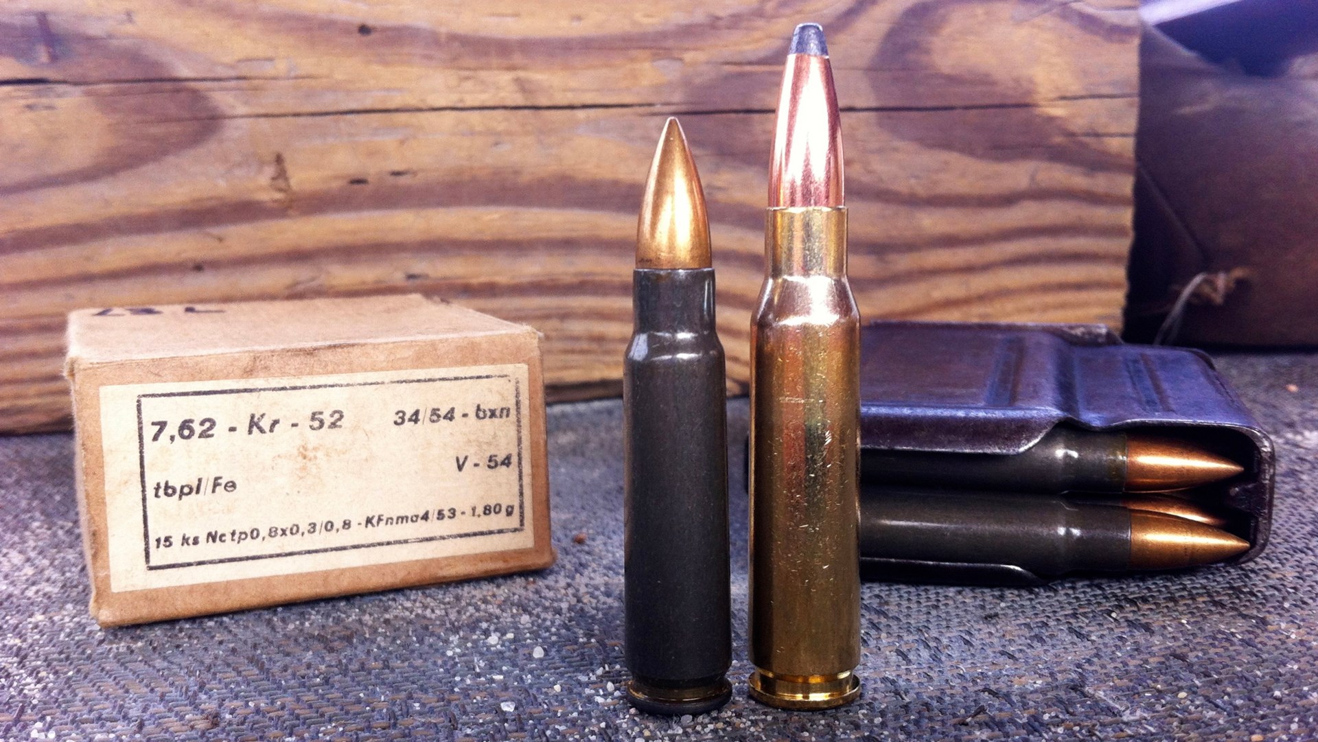 A 7.62×45 mm cartridge (left) and a 7.62×51 mm NATO cartridge (right) are seen here with an original box of Czech 7.62×45 mm ammunition and a loaded vz. 52 rifle magazine. Image courtesy of Martin K.A. Morgan.