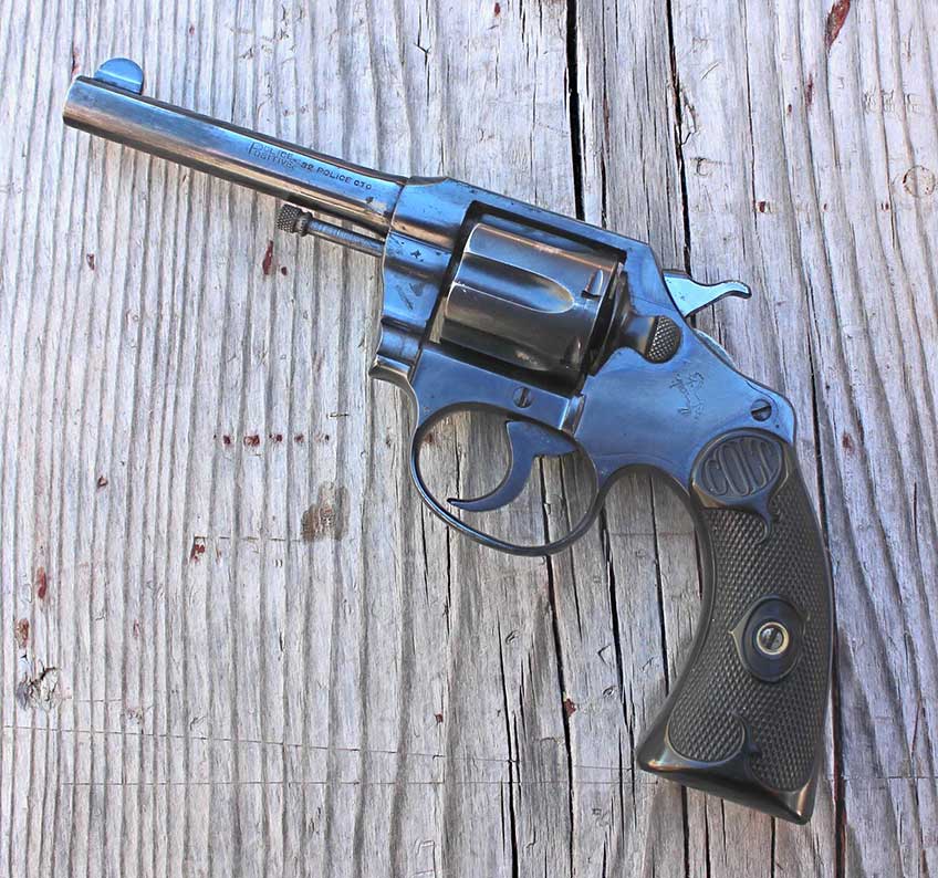 colt police positive left-side view on wood