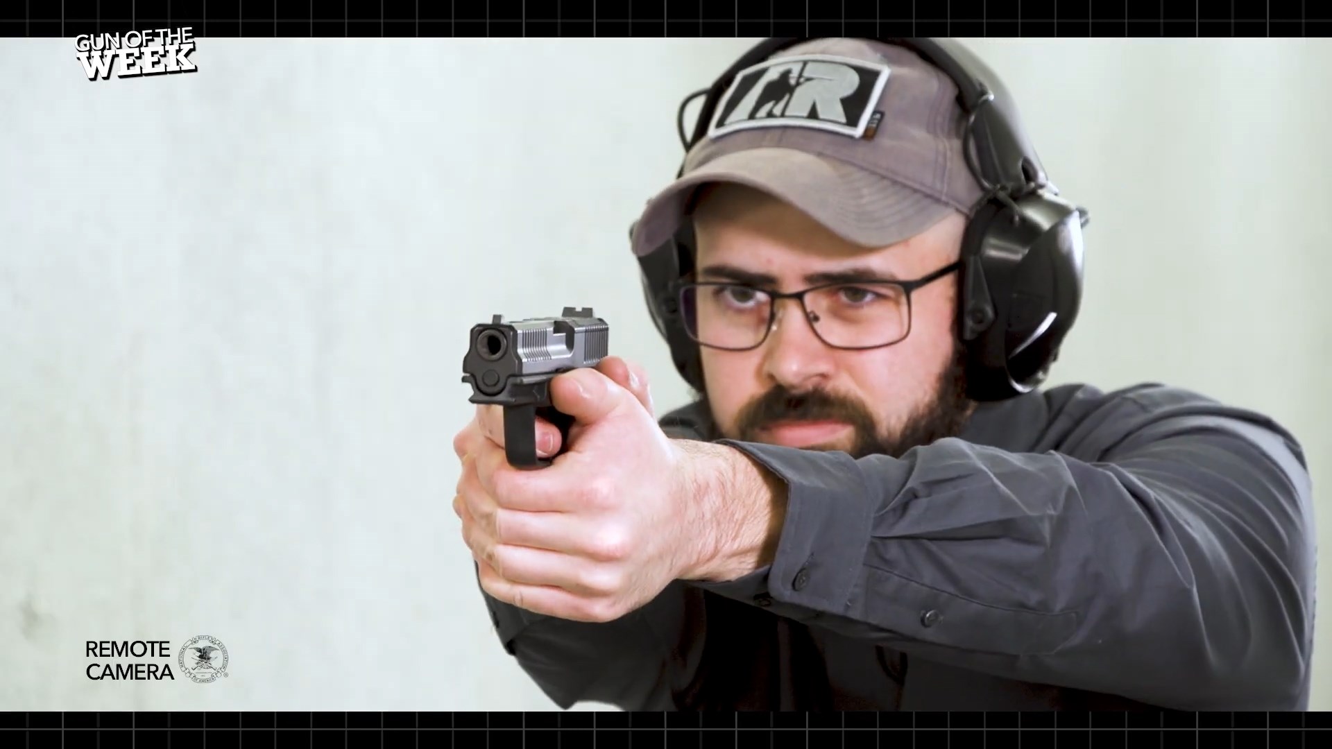 man on shooting range wearing protective gear shooting 9 mm FMK 9C1-G3 Elite pistol