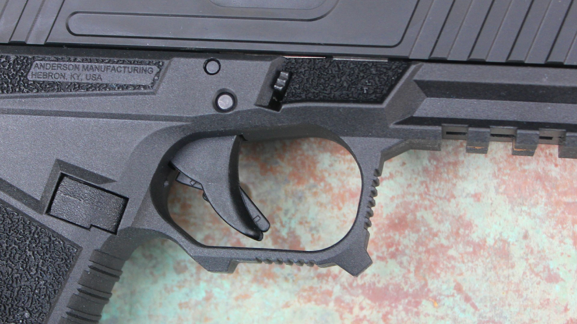Kiger 9c pistol closeup-view right side gun 9mm trigger and takedown lever plastic metal black