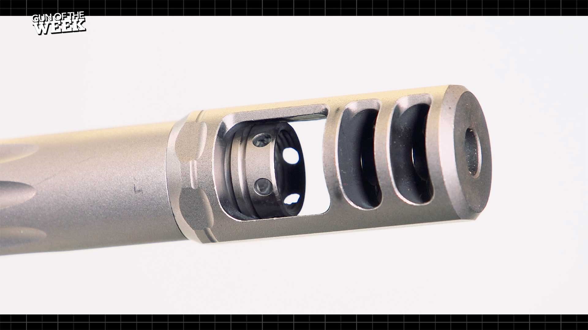 Silver muzzle brake at the end of the Browning X-Bolt Target Max rifle's barrel.