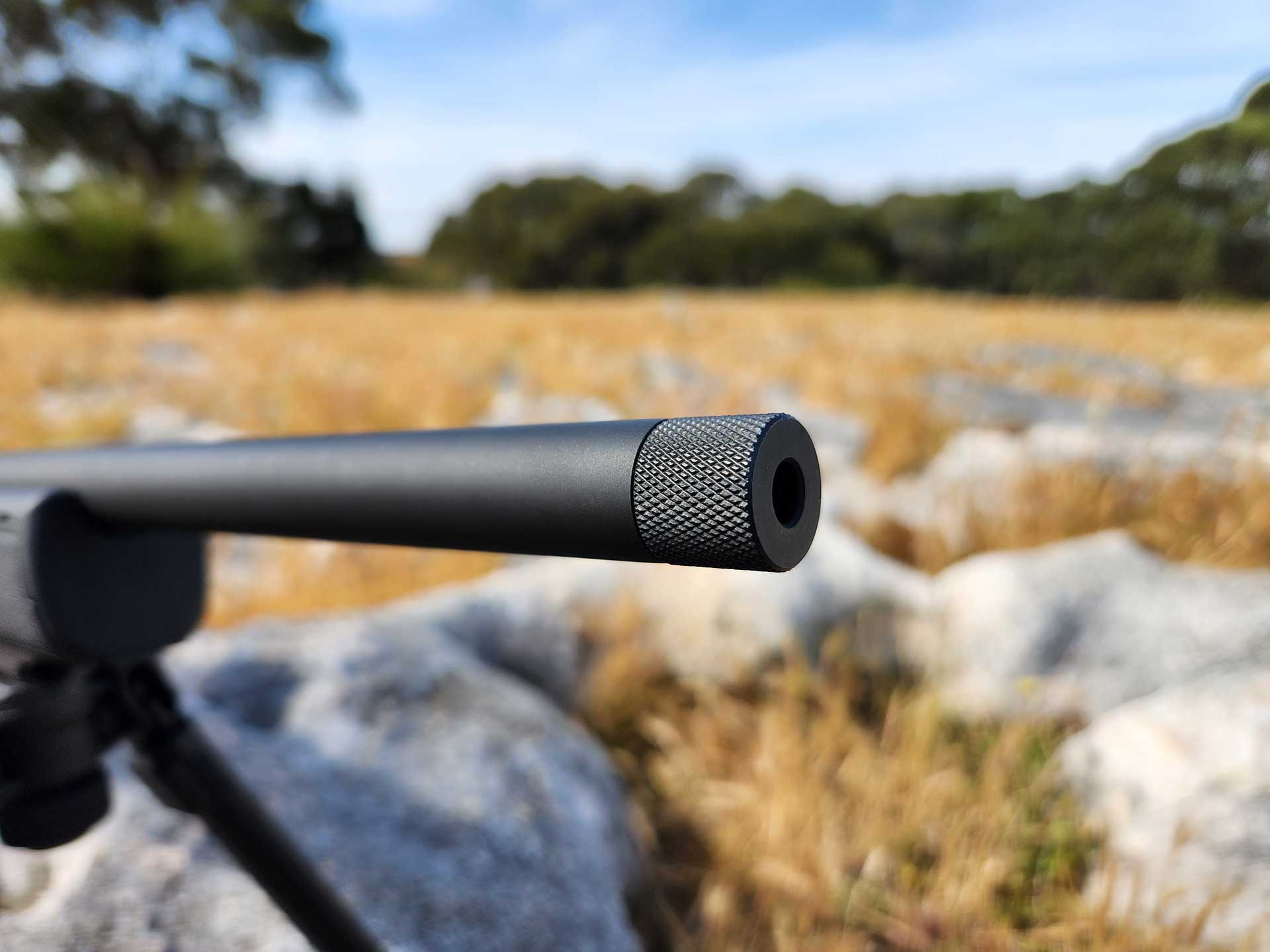 Knurled end cap on the threaded muzzle of the Hammerli Arms Force B1 rifle.