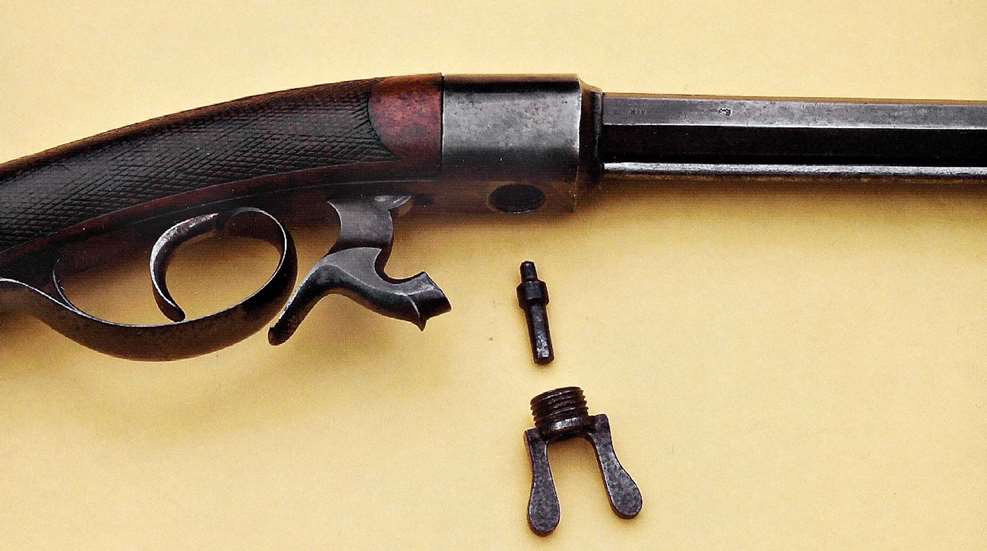 gun muzzleloader upsidedown mechanism yellow table screens threads steel wood