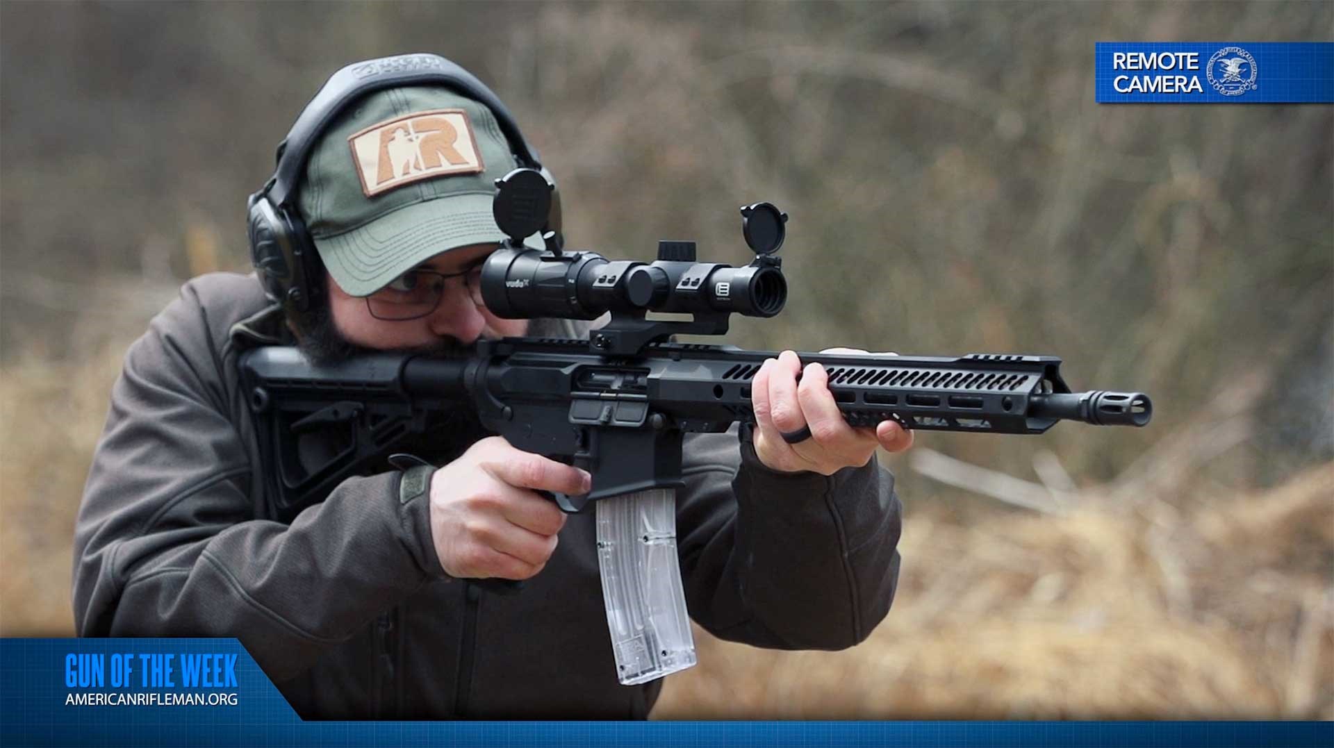 Man in green hat shooting the Rock River Arms LAR-22 Tactical Carbine on an outdoor range.