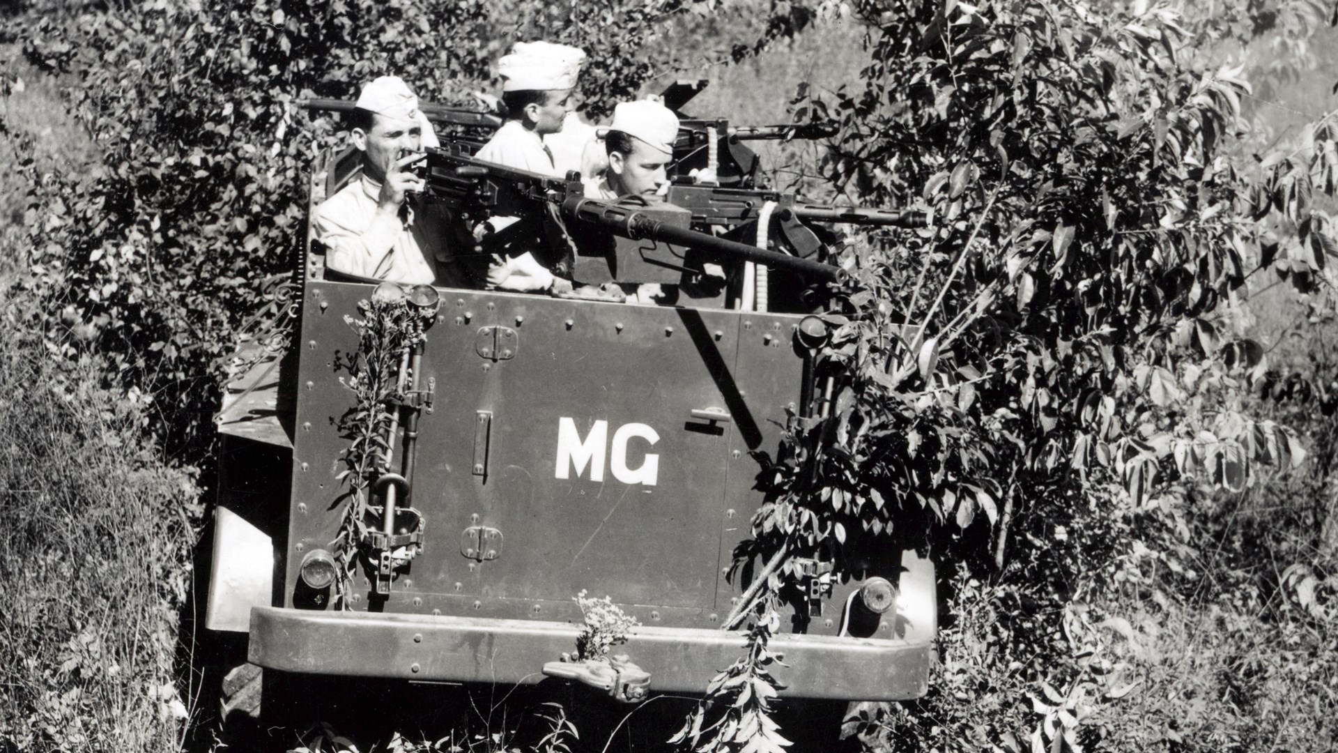 In the early days of America’s armored forces, US scout cars bristled with a combination of early Browning .30 Cal M1919 MGs coupled with the Browning M2 .50 caliber MG. Fort Knox, 1932.