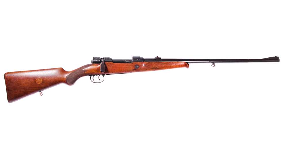Mauser “Cigarette” Rifle right side view on white background wood stock black metal butterknife handle schnabel fore-end