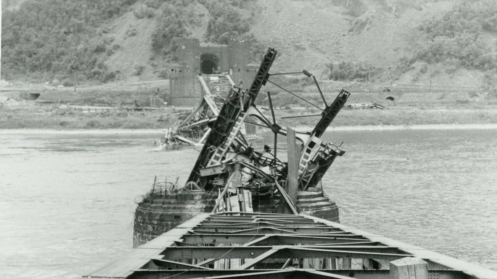 The twisted wreckage of the bridge after its collapse on March 17, 1945.
