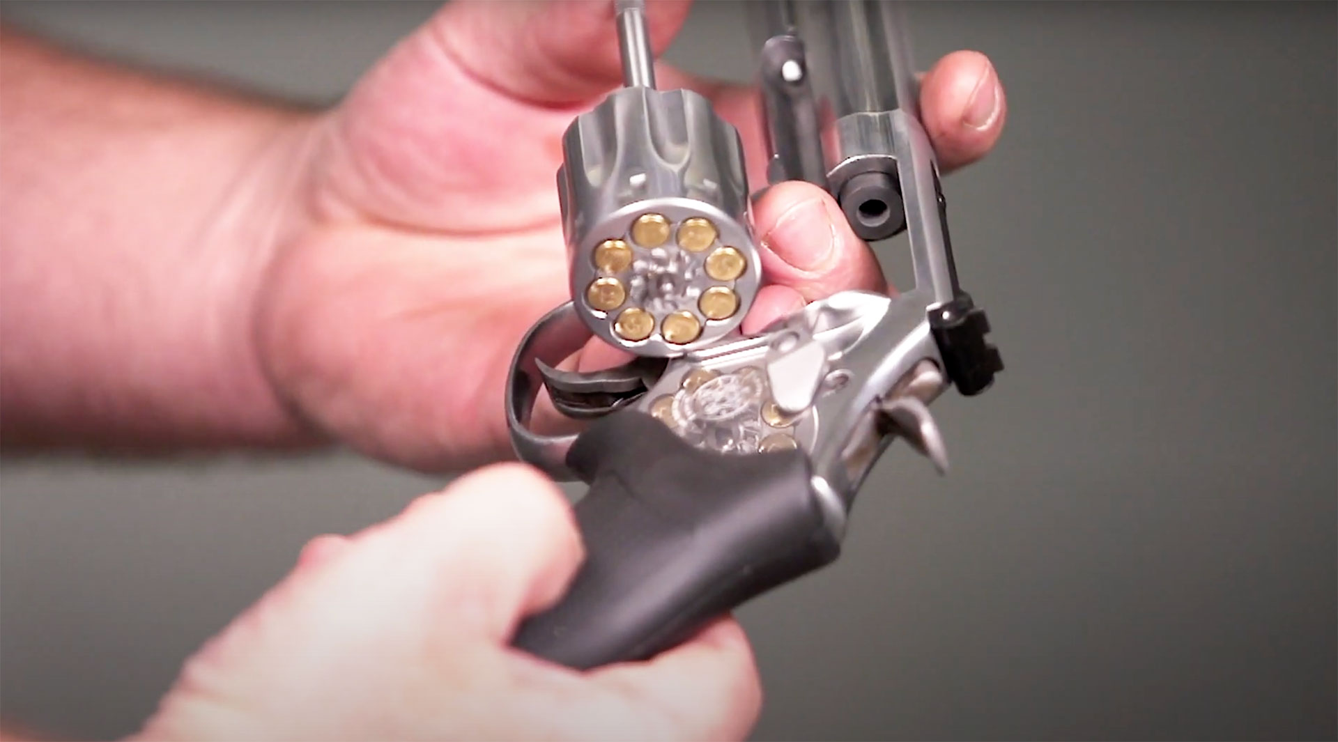 Smith & Wesson Model 648-2 revolver .22 WMR stainless black grip reloading.