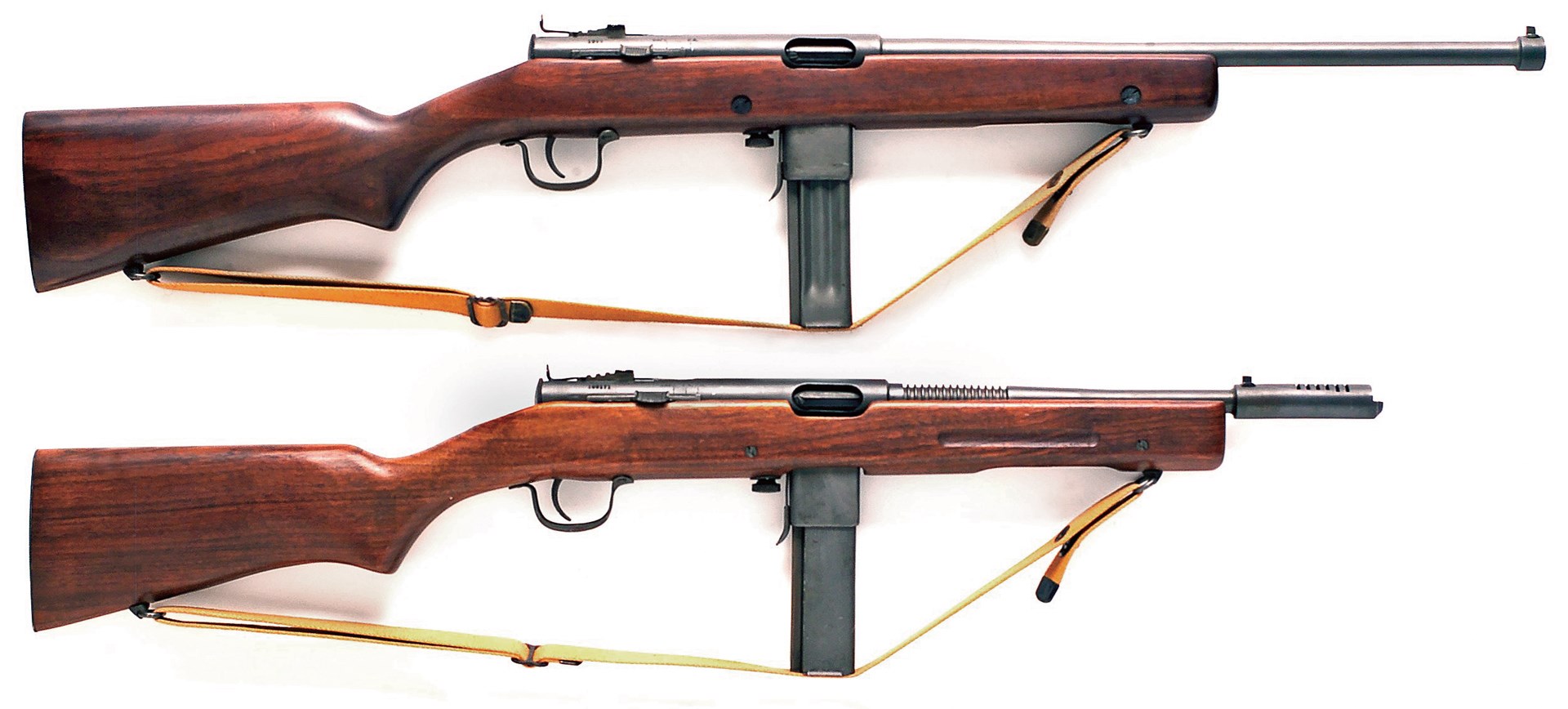 Model 50 and Model 60 reising submachine guns row stack wood stock guns black metal white background