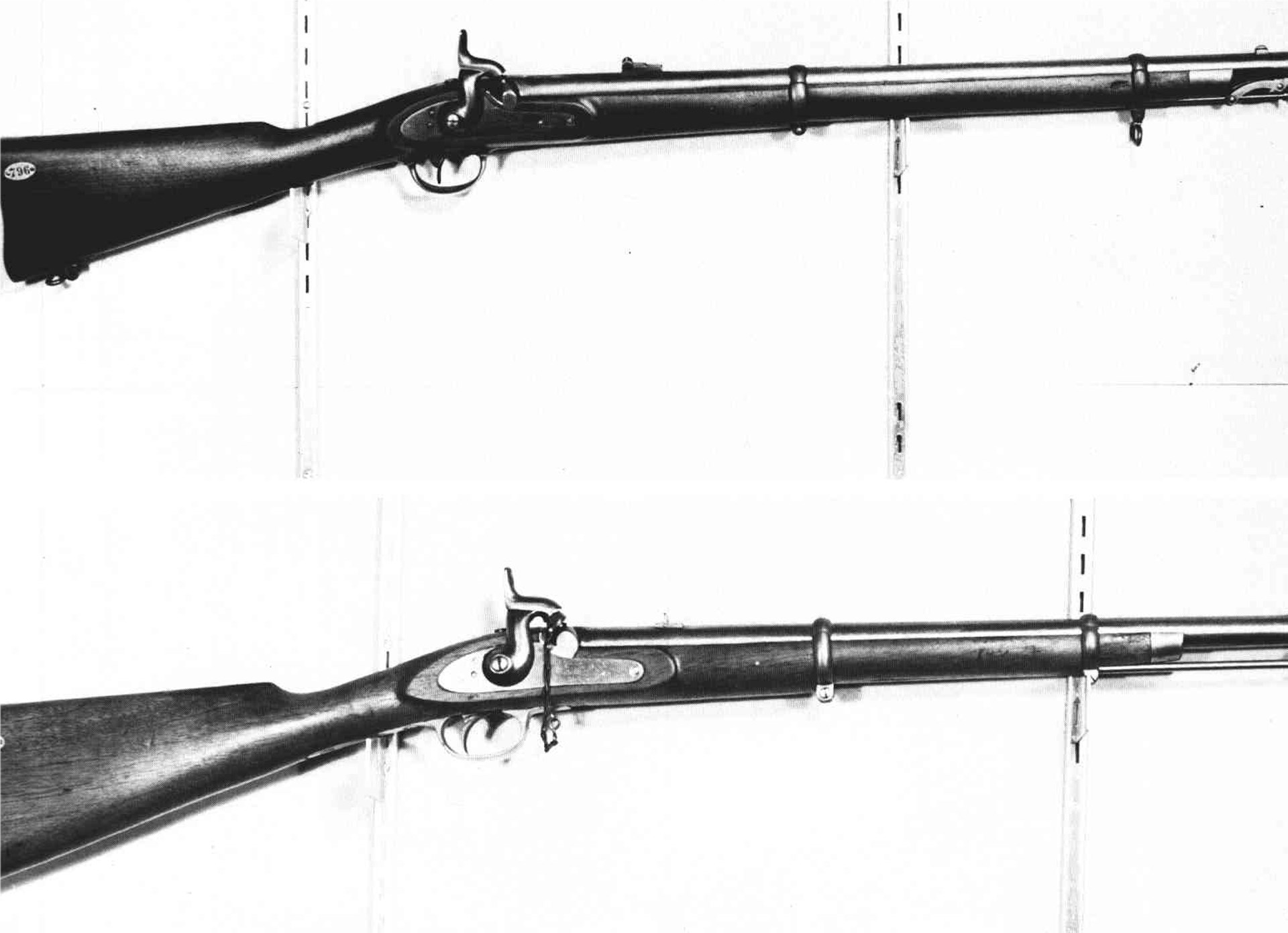 Two Tallassee carbines on white wall