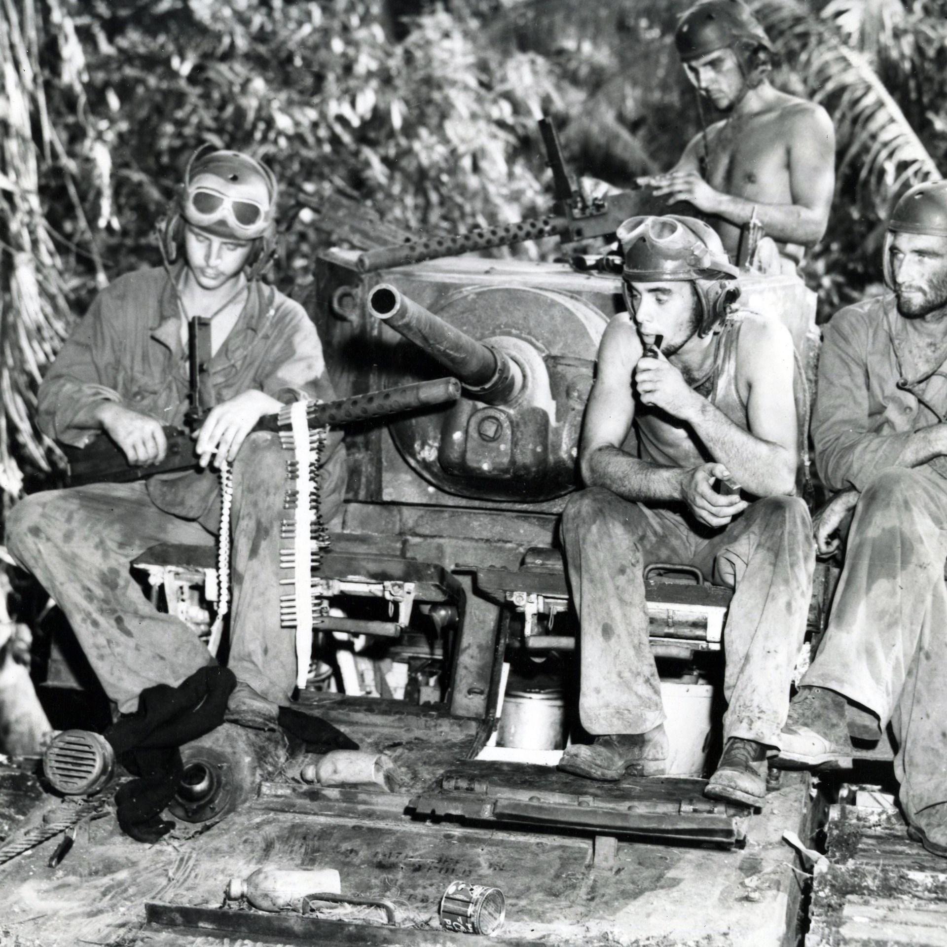 The initial version of the M3 Stuart light tank was equipped with up to five .30 Cal Browning M1919 machine guns. USMC, Munda summer 1943.