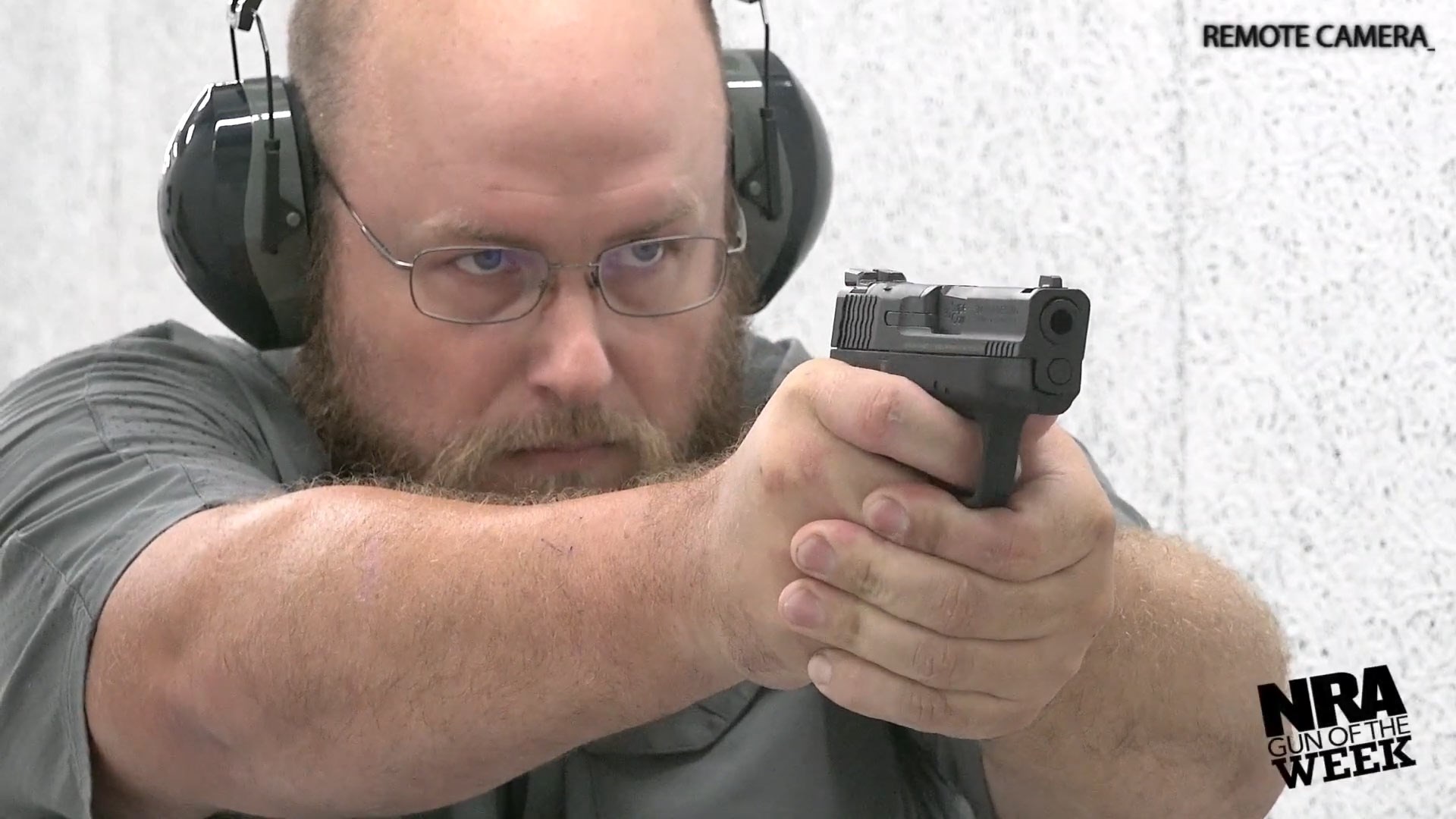 Man firing Smith & Wesson M&P Shield Plus 30 Super Carry pistol semi-automatic