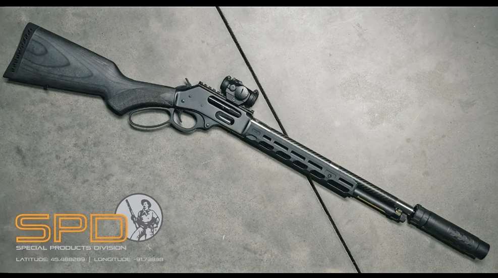 Right-side view Henry Special Products Division Hush-series lever-action rifle with carbon-fiber barrel, suppressor, Picatinny rail, M-Lok wood buttstock red-dot optic logo lower left-corner
