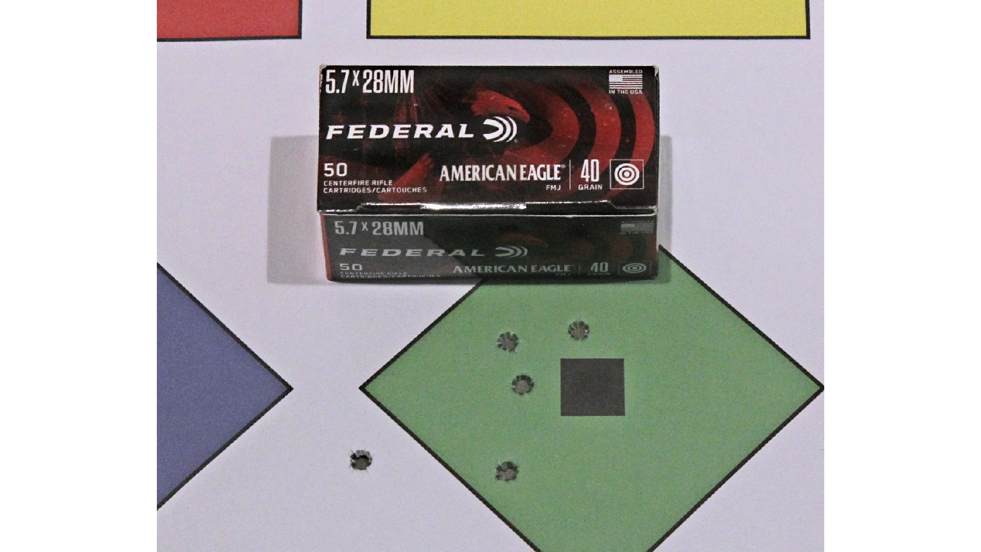 Federal 5.7x28 mm FN ammunition box shown on green diamond target with bullet holes group size