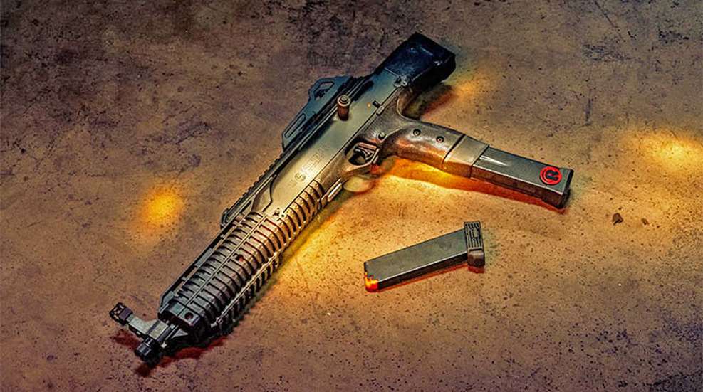 Hi Point large-format pistol left-side view shown with magazine on floor concrete
