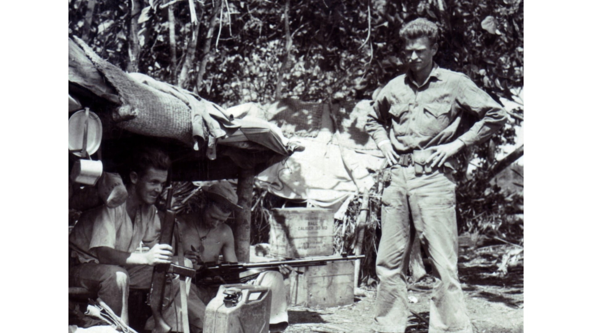 USMC men working on BAR guns in the field under tent Guadalcanal 1944