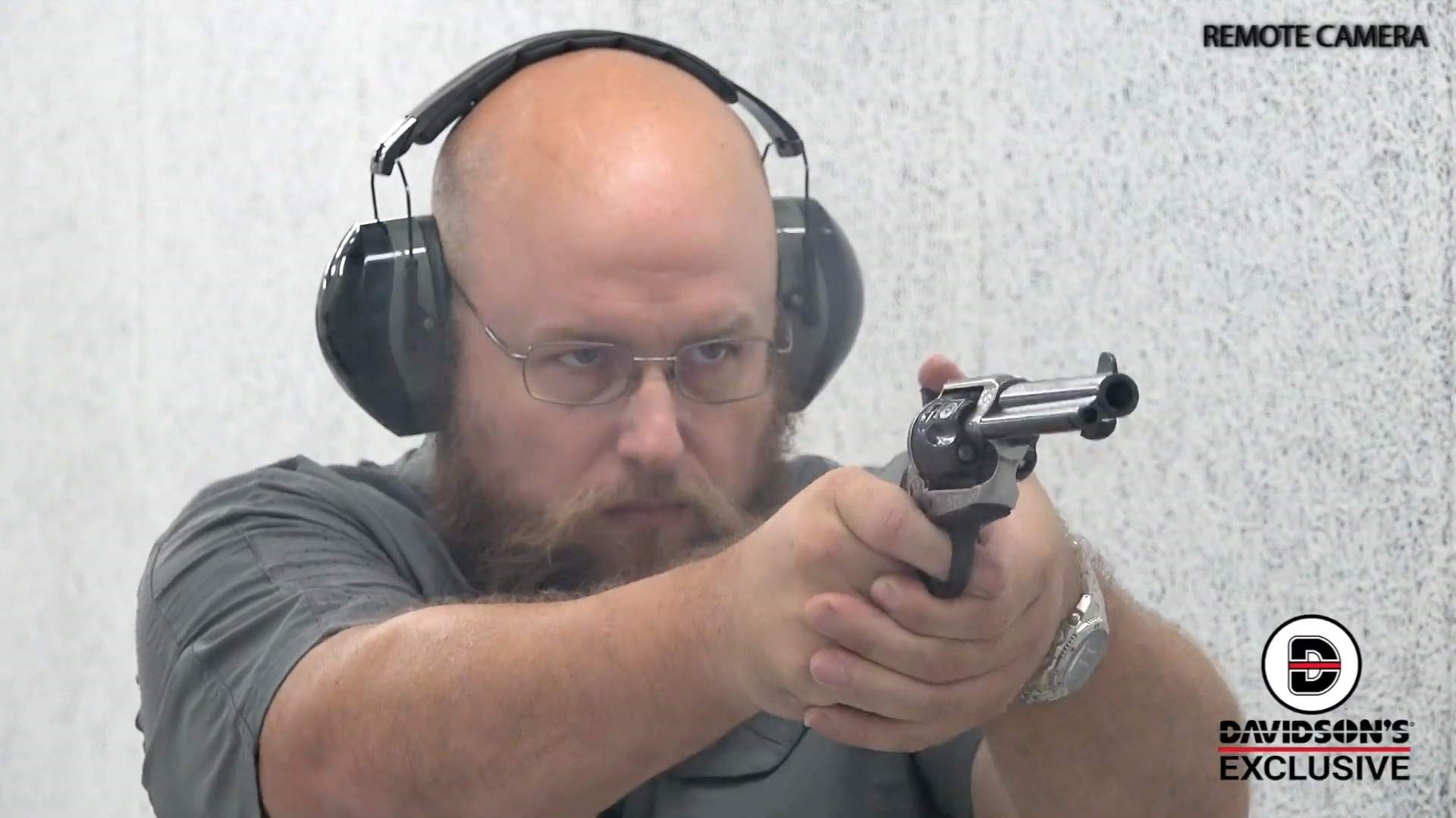 man on range with silver and black revolver davidson's exclusive remote camera