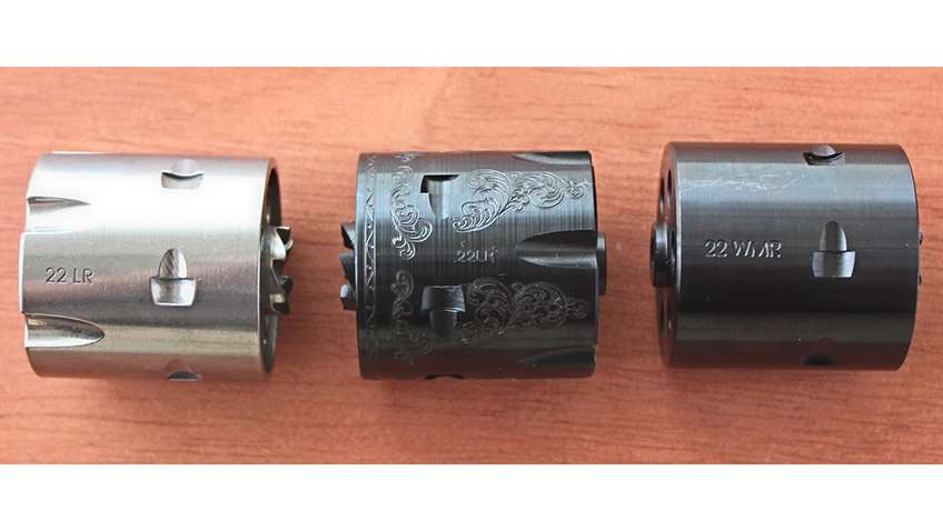 row of three revolver cylinders