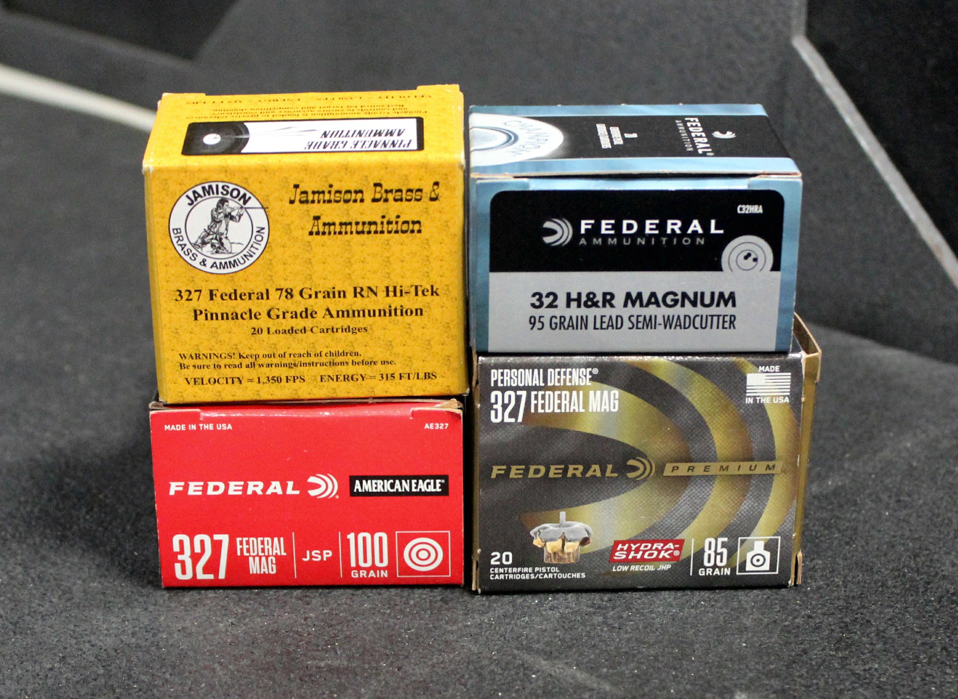 .327 Federal Magnum ammunition boxes stack four colors squares .32 H&R box federal premium Jamison Ammunition