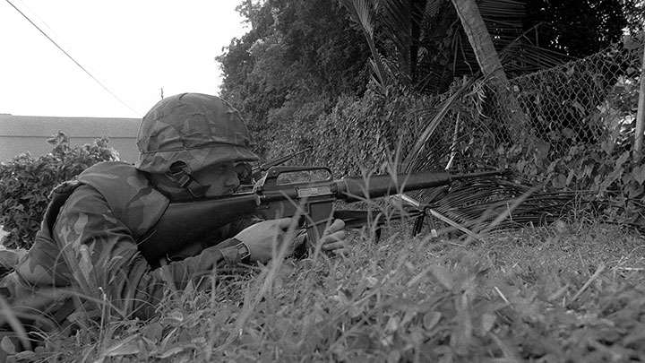 Every Marine a rifleman: a USMC M16A1 in action on Grenada.