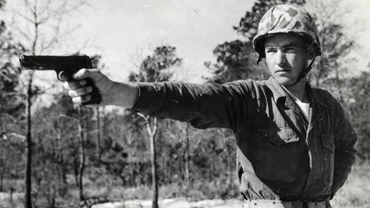 A handful of handgun:  A Marine poses with the mighty M1911 during the early days of the Vietnam War.