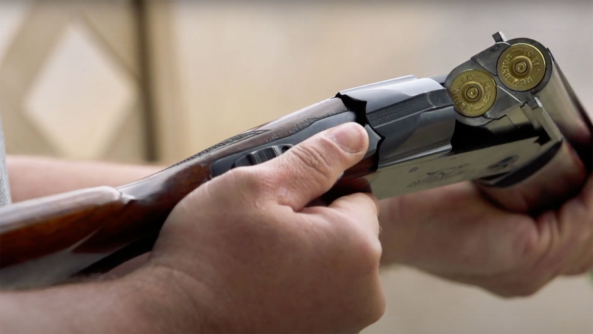 The action of a Remington Model 32 opened, note the sliding plate at the top of the action which locks against the top barrel.