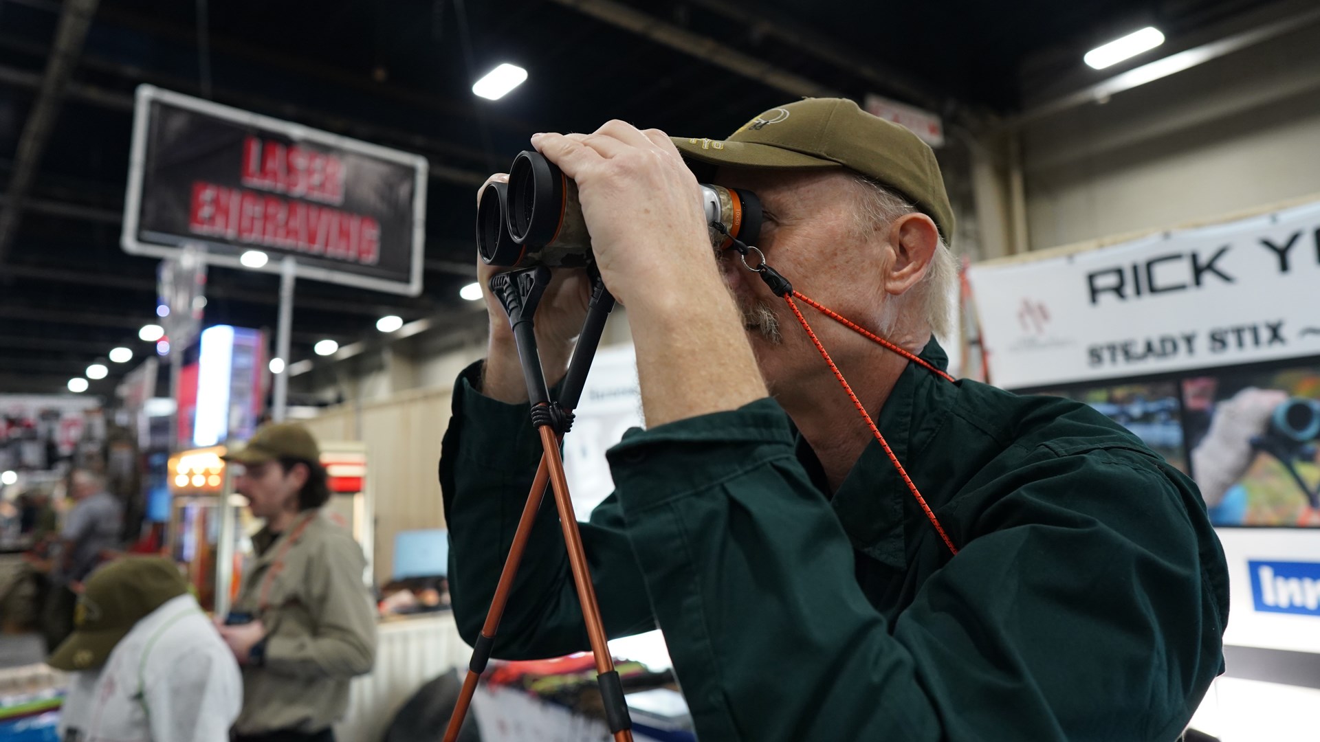 rick young outdoors steady stix in use trade show man with binos