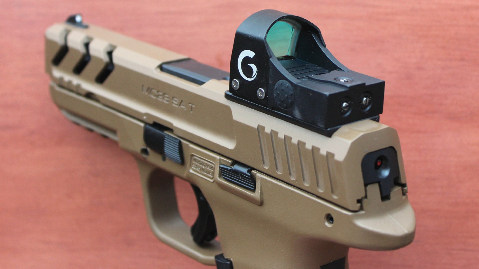 Girsan/EAA pistol handgun flat dark earth color gun with red-dot optic attached to the top of the slide