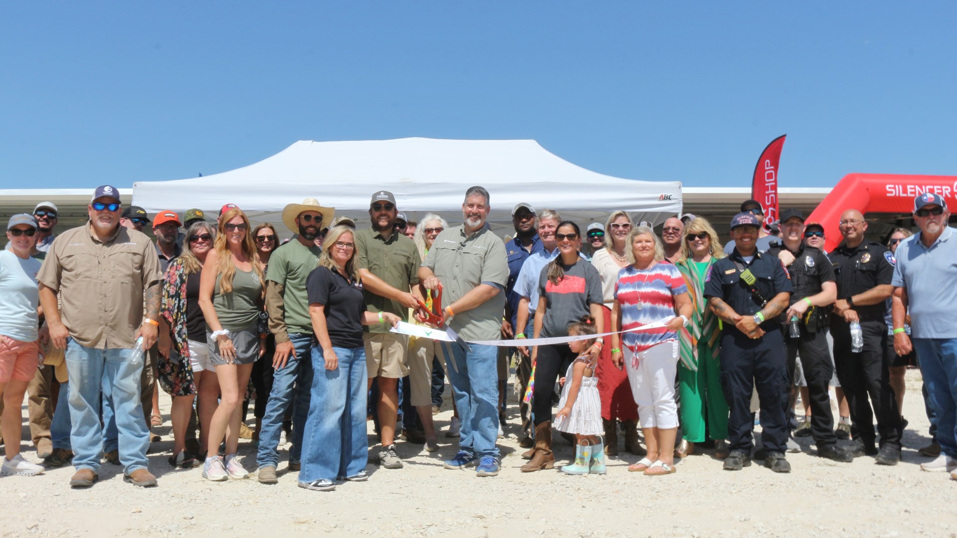 Sellmark Ranch grand opening ribbon-cutting line of people outdoors